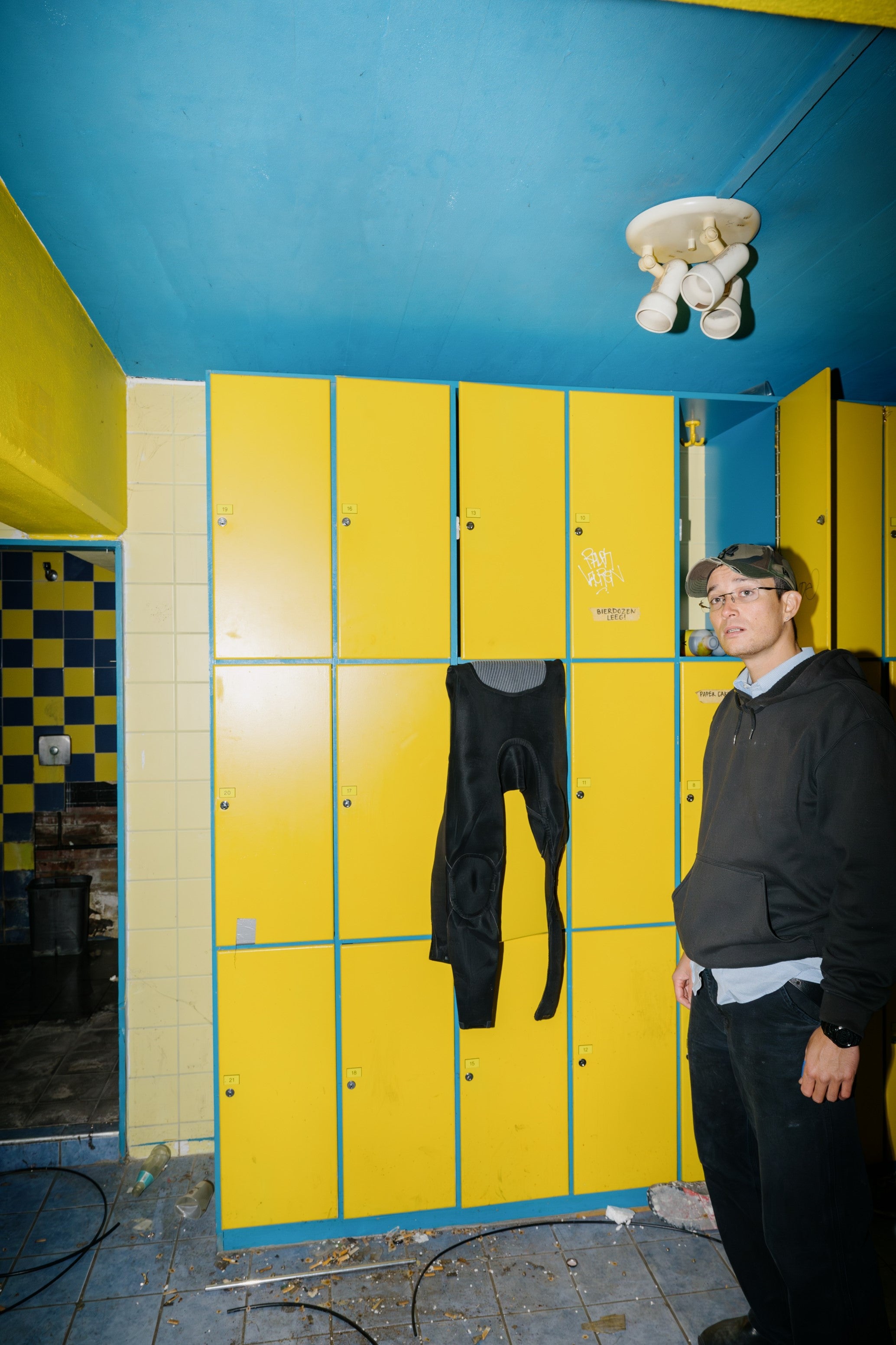 Twan standing in front of lockers