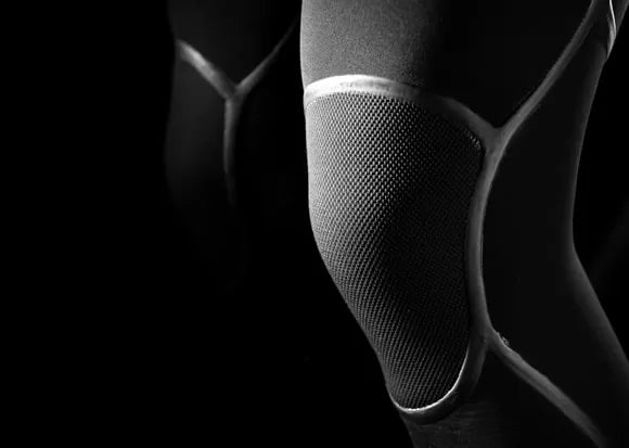 Closeup on kneepads of SRFACE wetsuit